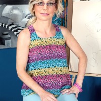 Geeky mature MILF Diandra flashes her perky little tits afore a younger man