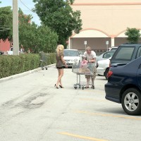 Leggy mature blonde Kayla Ann seduces a younger boy in the grocery parking lot